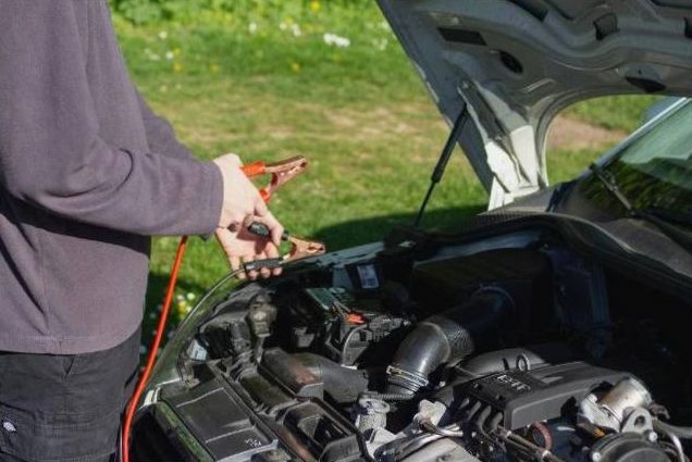 Technician scanning vehicle OBD port
